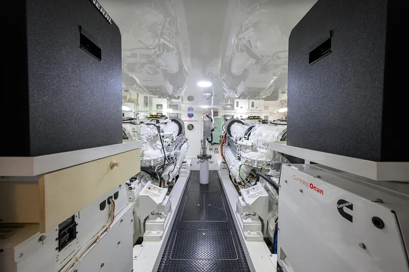 Corintios Yacht Photos Pics Engine room of 2018 Viking 72 Skybridge yacht, featuring Cummins Onan generators.