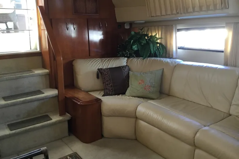  Yacht Photos Pics Luxurious interior of 2003 Carver 396 Motor Yacht with leather seating and wooden accents.
