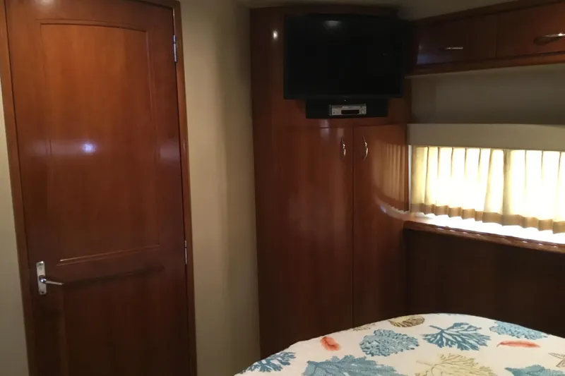  Yacht Photos Pics Interior of 2003 Carver 396 Motor Yacht with wood cabinetry and TV.