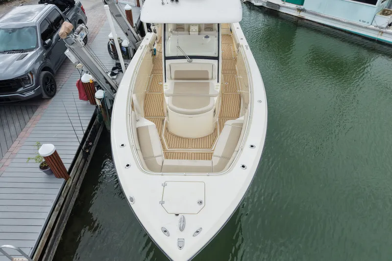  Yacht Photos Pics 2015 Cobia 344 Center Console boat docked, aerial view showing spacious deck and seating.