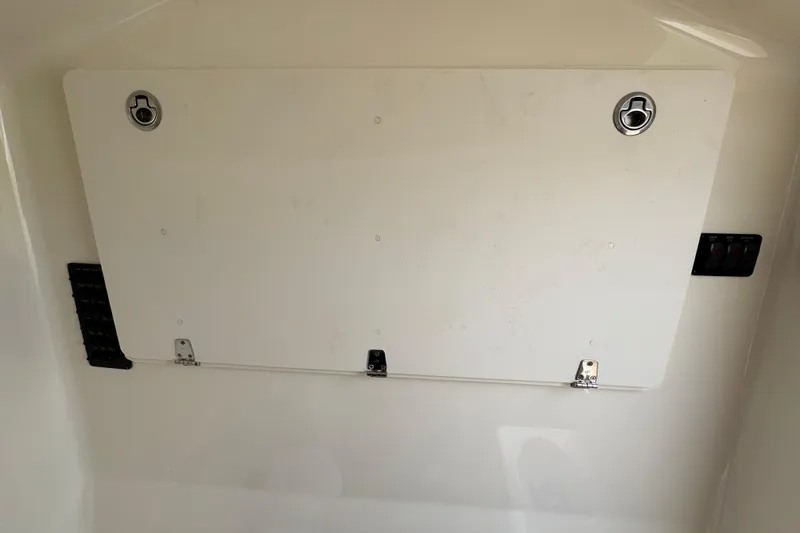  Yacht Photos Pics 2015 Cobia 344 Center Console storage compartment with secure latches and sleek design.