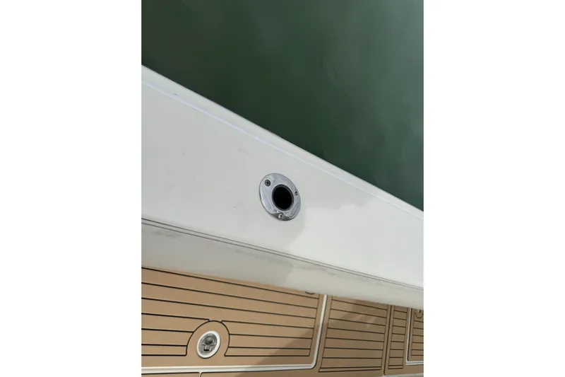  Yacht Photos Pics 2015 Cobia 344 Center Console boat deck with rod holder and teak flooring.