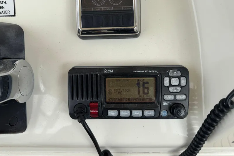  Yacht Photos Pics VHF marine radio on 2015 Cobia 344 Center Console boat dashboard.