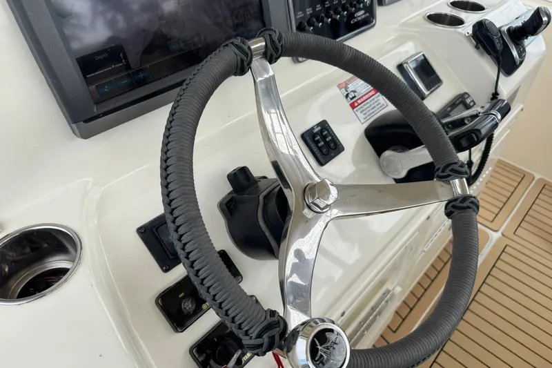  Yacht Photos Pics Steering wheel and controls of 2015 Cobia 344 Center Console boat.