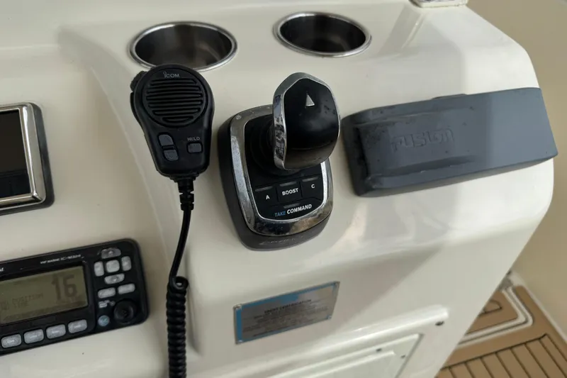  Yacht Photos Pics 2015 Cobia 344 Center Console boat controls with radio and throttle.
