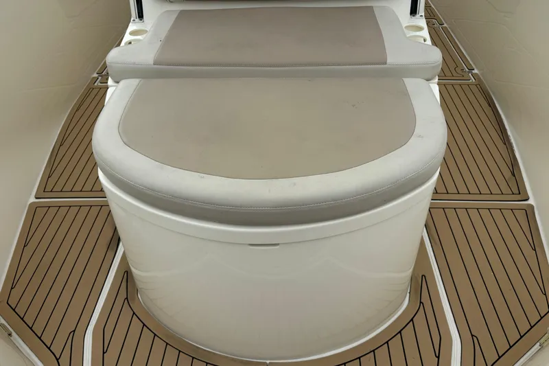  Yacht Photos Pics 2015 Cobia 344 Center Console boat seating with cushioned bench and teak-style flooring.