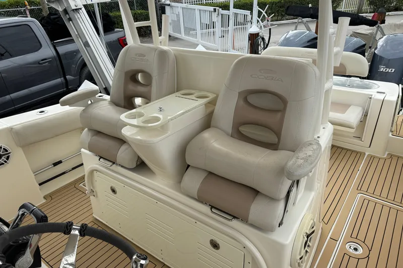  Yacht Photos Pics 2015 Cobia 344 Center Console boat with dual captain's chairs and teak flooring.