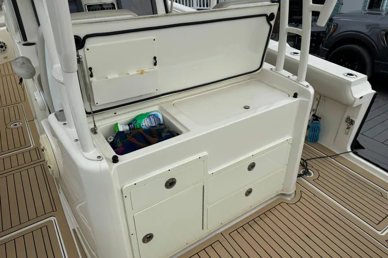  Yacht Photos Pics 2015 Cobia 344 Center Console boat interior with storage compartment open.