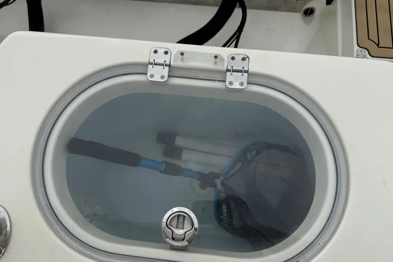  Yacht Photos Pics Livewell on 2015 Cobia 344 Center Console boat with fishing gear inside.