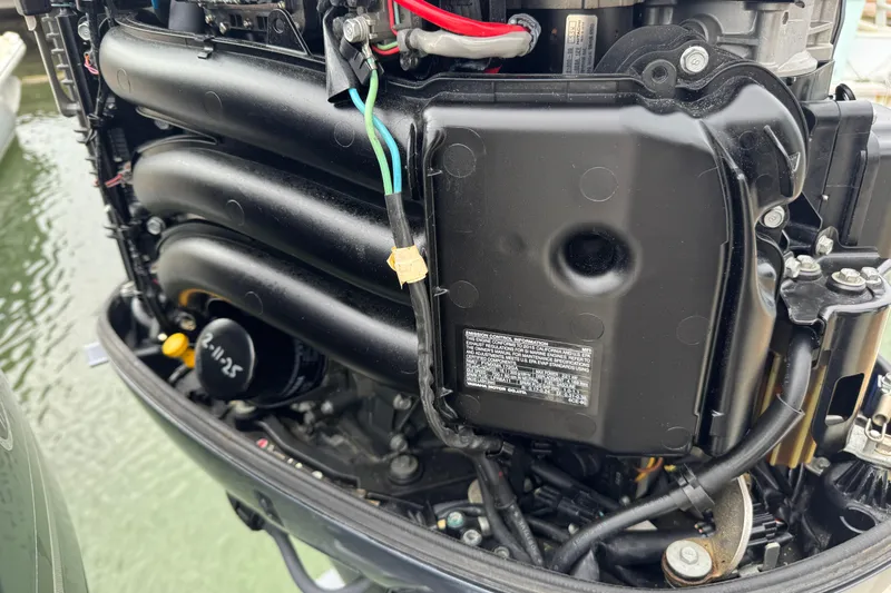  Yacht Photos Pics 2015 Cobia 344 Center Console engine close-up, showcasing intricate mechanical components.