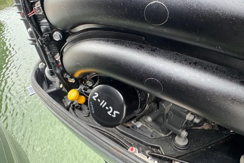  Yacht Photos Pics Engine detail of 2015 Cobia 344 Center Console boat near water.