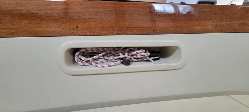 Caprice Yacht Photos Pics Storage compartment with rope on a 2023 C.W. Hood 32 Daysailer.