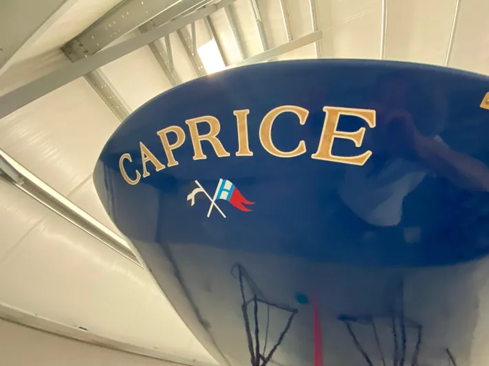 Caprice Yacht Photos Pics 2023 C.W. Hood 32 Daysailer, blue hull with "Caprice" lettering in a boatyard.