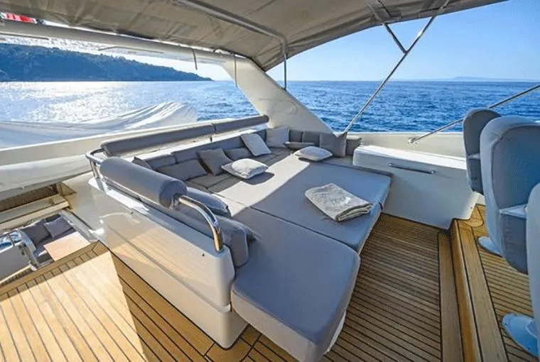  Yacht Photos Pics Luxurious Moonen 68 yacht deck with sun loungers, ocean view, and elegant seating, 1995 model.