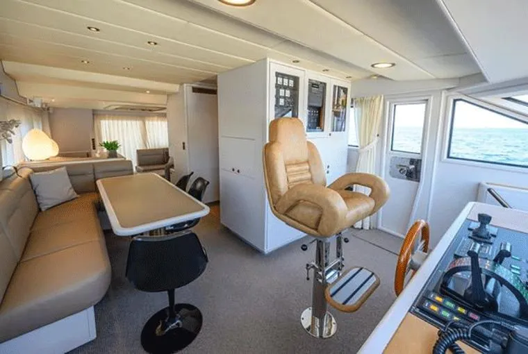  Yacht Photos Pics Luxurious interior of a 1995 Moonen 68 yacht with modern seating and navigation area.