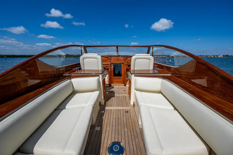 Pampelonne Yacht Photos Pics 2018 Hinckley 34 Runabout with elegant wood finish and white seating on open water.