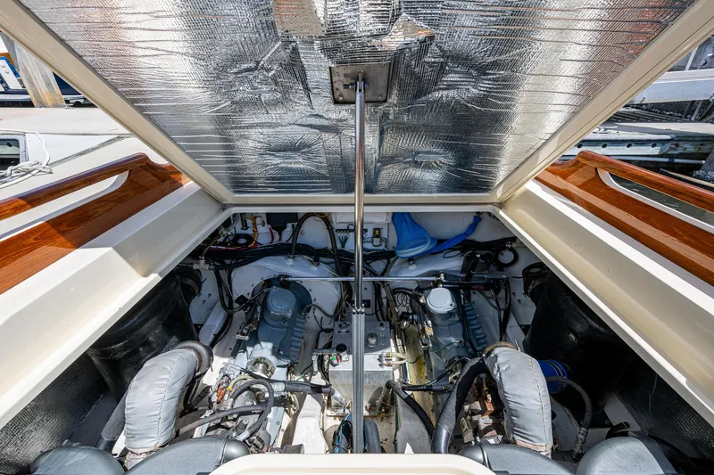 Pampelonne Yacht Photos Pics Engine compartment of a 2018 Hinckley 34 Runabout, showcasing dual engines and mechanical components.