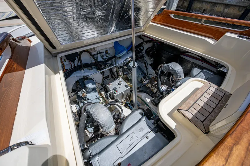 Pampelonne Yacht Photos Pics Engine compartment of a 2018 Hinckley 34 Runabout boat, showcasing mechanical components.