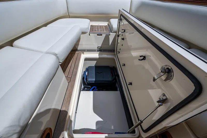 Pampelonne Yacht Photos Pics 2018 Hinckley 34 Runabout interior storage compartment with open hatch and seating.