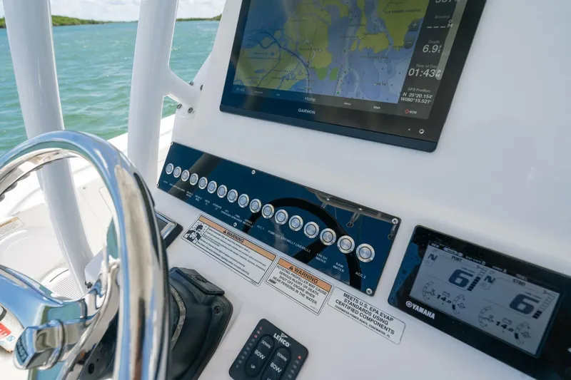  Yacht Photos Pics 2017 Edgewater 318CC boat dashboard with Garmin navigation and Yamaha controls.