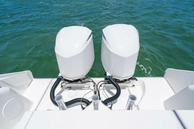  Yacht Photos Pics 2017 Edgewater 318CC boat with dual outboard engines on open water.