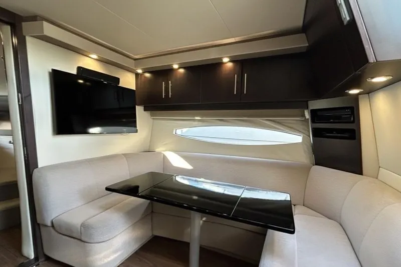  Yacht Photos Pics 2018 Regal 42 Sport Coupe interior with modern seating, table, and TV.