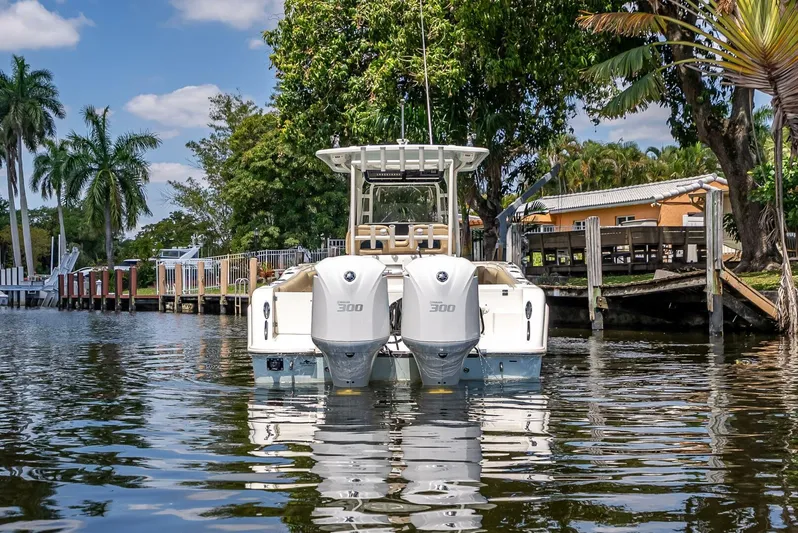  Yacht Photos Pics 2020 Key West Billistic 281 boat with dual engines on a calm waterway.