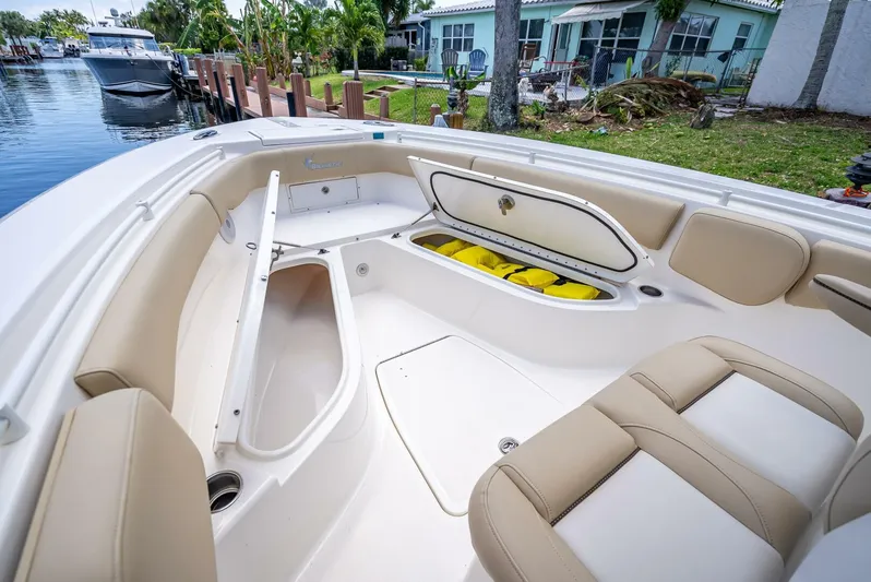  Yacht Photos Pics 2020 Key West Billistic 281 boat interior with open storage compartments and seating.
