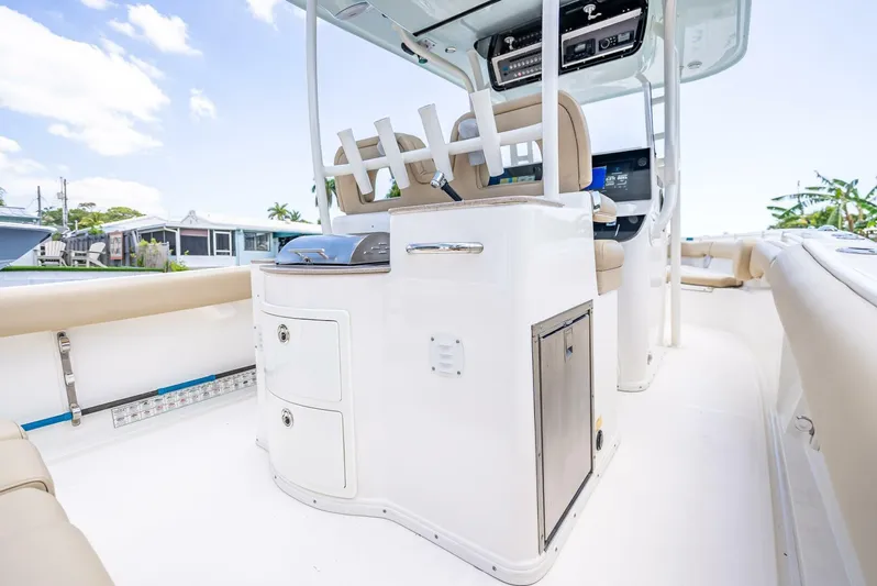  Yacht Photos Pics 2020 Key West Billistic 281 boat interior with seating and storage compartments.