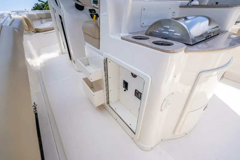  Yacht Photos Pics 2020 Key West Billistic 281 boat interior with storage and grill.