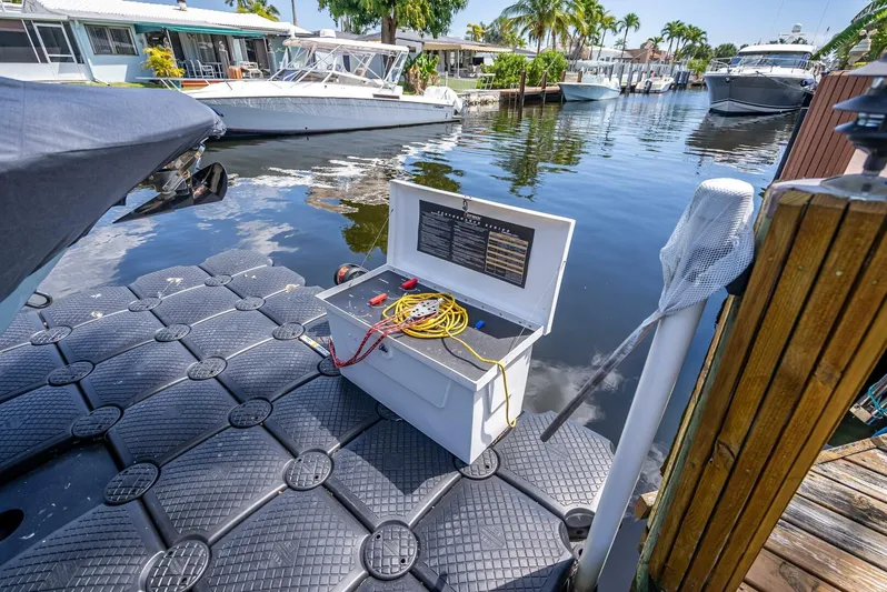  Yacht Photos Pics Floating dock with open utility box, near Key West Billistic 281 boat, 2020 model, in sunny marina.