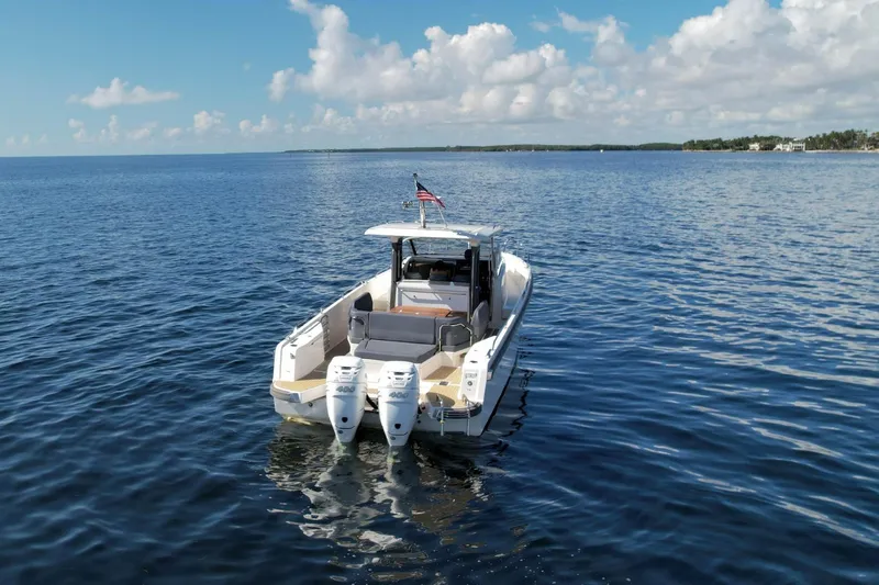T/t Sophia Yacht Photos Pics 2022 Nimbus T11 boat on open water under a clear sky.
