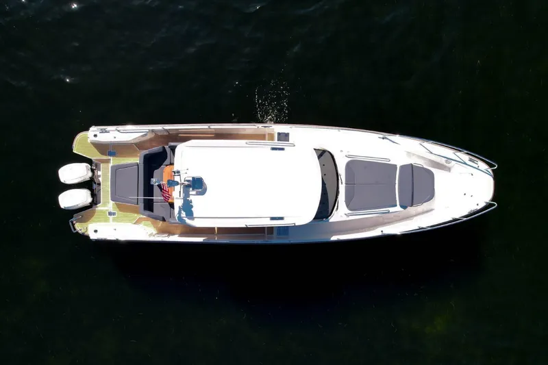T/t Sophia Yacht Photos Pics Overhead view of 2022 Nimbus T11 boat on dark water.