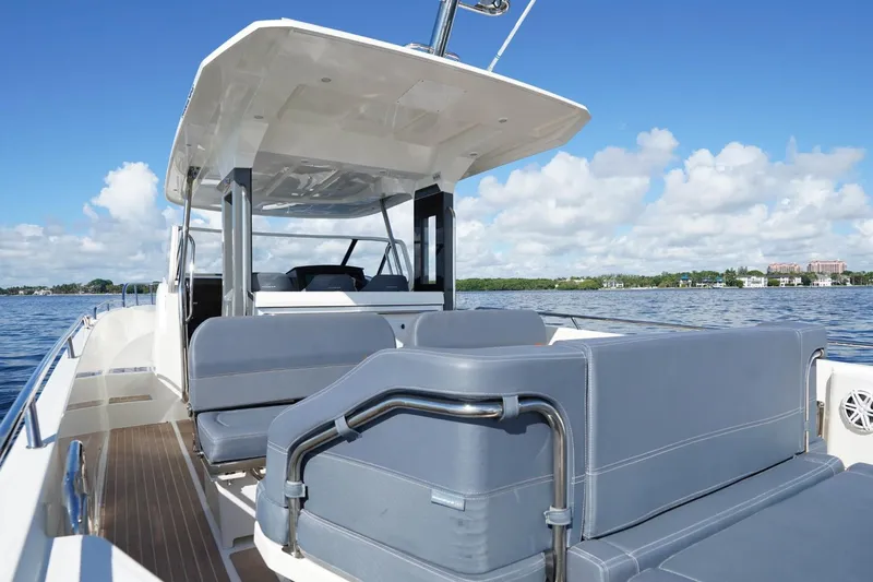 T/t Sophia Yacht Photos Pics 2022 Nimbus T11 boat with spacious seating, cruising on a sunny day.