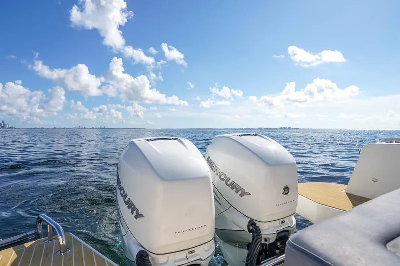 T/t Sophia Yacht Photos Pics 2022 Nimbus T11 boat with twin Mercury outboard engines on open water.