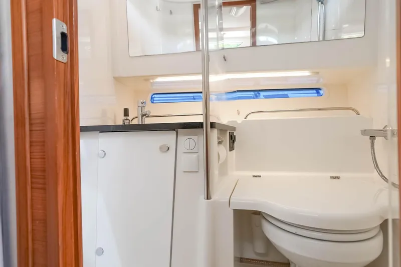 T/t Sophia Yacht Photos Pics Modern bathroom in 2022 Nimbus T11 boat with sleek fixtures and compact design.
