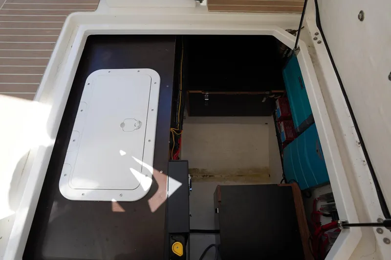 T/t Sophia Yacht Photos Pics Storage compartment of 2022 Nimbus T11 boat, featuring organized equipment and wiring.