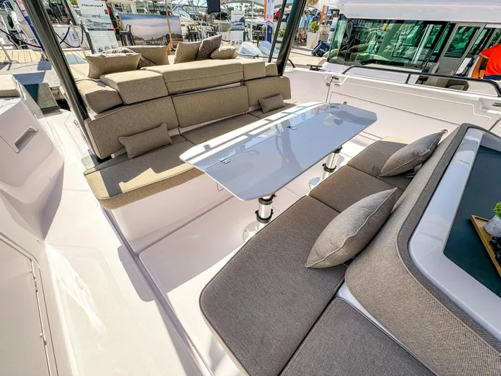  Yacht Photos Pics 2024 Axopar 45 ST BRABUS Trim Mediterrana boat interior with luxurious seating and table.