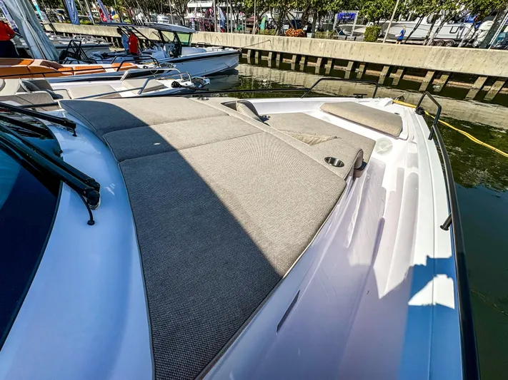  Yacht Photos Pics 2024 Axopar 45 ST BRABUS Trim Mediterrana boat docked, featuring spacious sunbathing area.