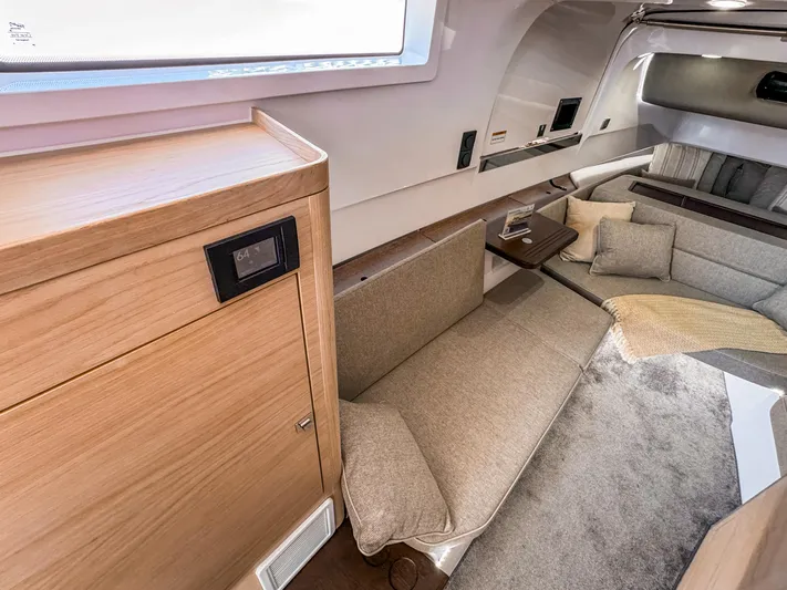  Yacht Photos Pics 2024 Axopar 45 ST BRABUS Trim Mediterrana interior with modern seating and wooden accents.