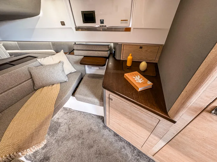  Yacht Photos Pics Luxurious interior of 2024 Axopar 45 ST BRABUS Trim Mediterrana with cozy seating and modern decor.