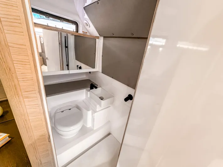  Yacht Photos Pics 2024 Axopar 45 ST BRABUS Trim Mediterrana bathroom interior, featuring modern fixtures and sleek design.