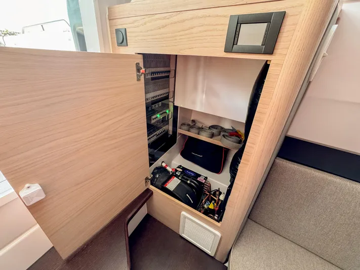  Yacht Photos Pics Interior view of 2024 Axopar 45 ST BRABUS Trim Mediterrana storage compartment.