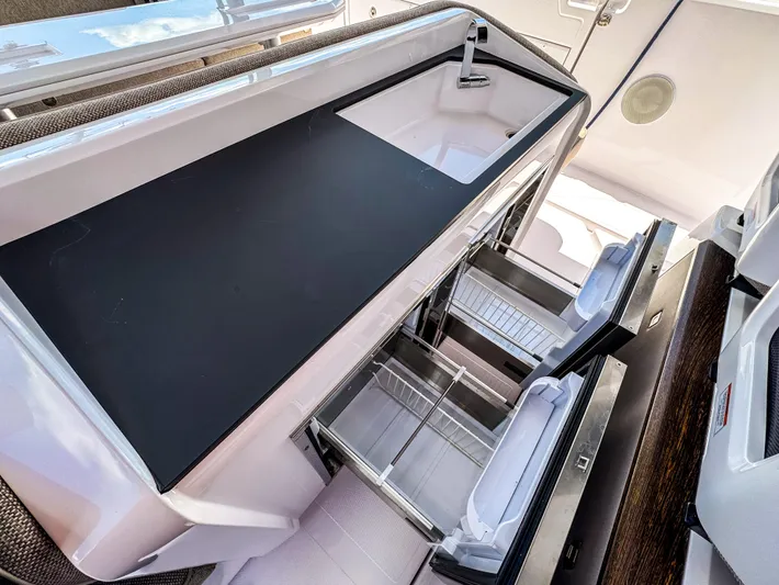  Yacht Photos Pics 2024 Axopar 45 ST BRABUS Trim Mediterrana kitchen area with sleek design and modern amenities.