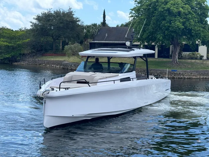  Yacht Photos Pics 2024 Axopar 45 ST BRABUS Trim Mediterrana cruising on a serene waterway.