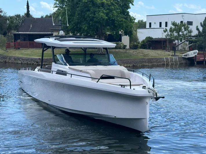  Yacht Photos Pics 2024 Axopar 45 ST BRABUS Trim Mediterrana cruising on a serene waterway.