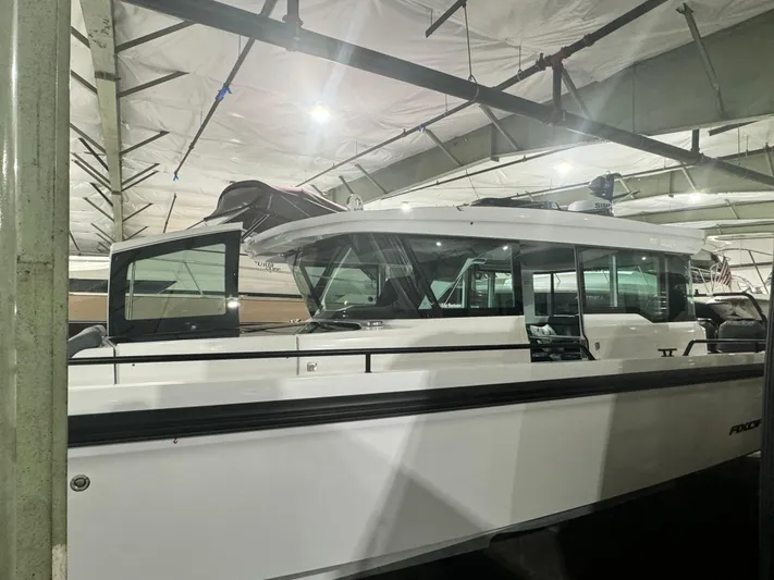 Escape Artist Yacht Photos Pics 2020 Axopar 37 Cross Cabin BRABUS in indoor storage facility.