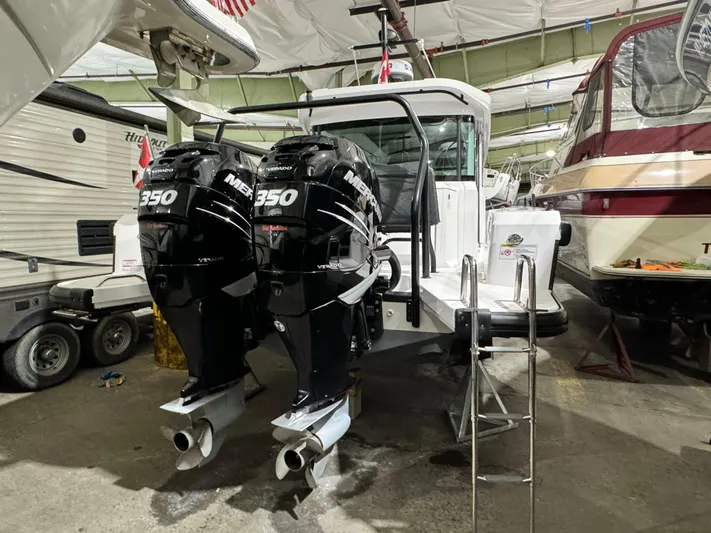 Escape Artist Yacht Photos Pics 2020 Axopar 37 Cross Cabin BRABUS with twin Mercury 350 engines in storage.