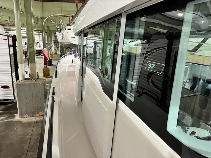 Escape Artist Yacht Photos Pics 2020 Axopar 37 Cross Cabin BRABUS in a storage facility, side view.