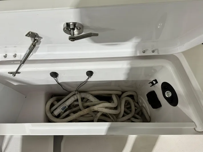 Escape Artist Yacht Photos Pics Storage compartment with ropes in a 2020 Axopar 37 Cross Cabin BRABUS boat.